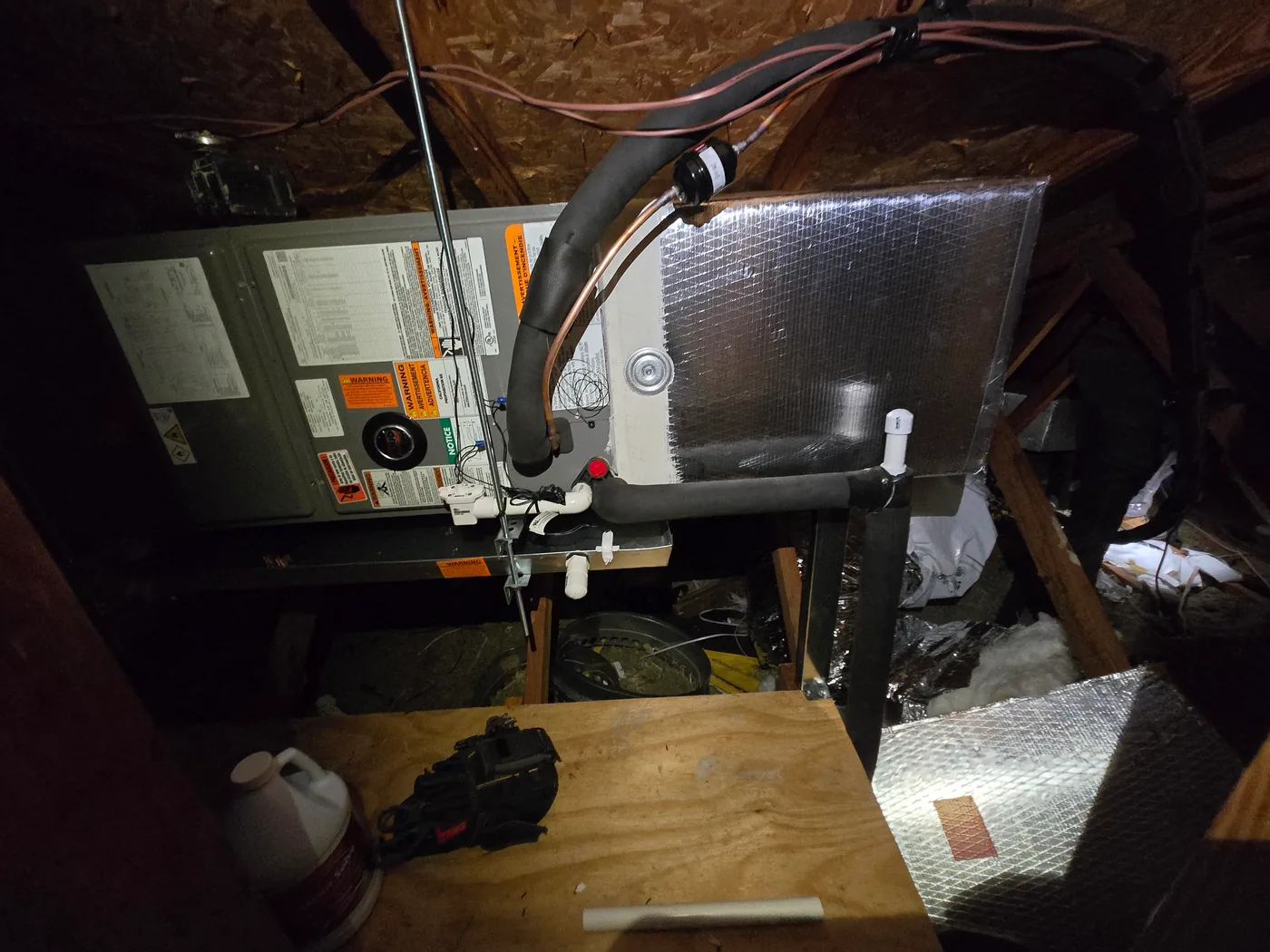 Attic air handler with refrigerant lines and condensate drain